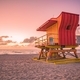 Sunrise on the beach with an orange Art Deco style lifeguard station  - PhotoDune Item for Sale