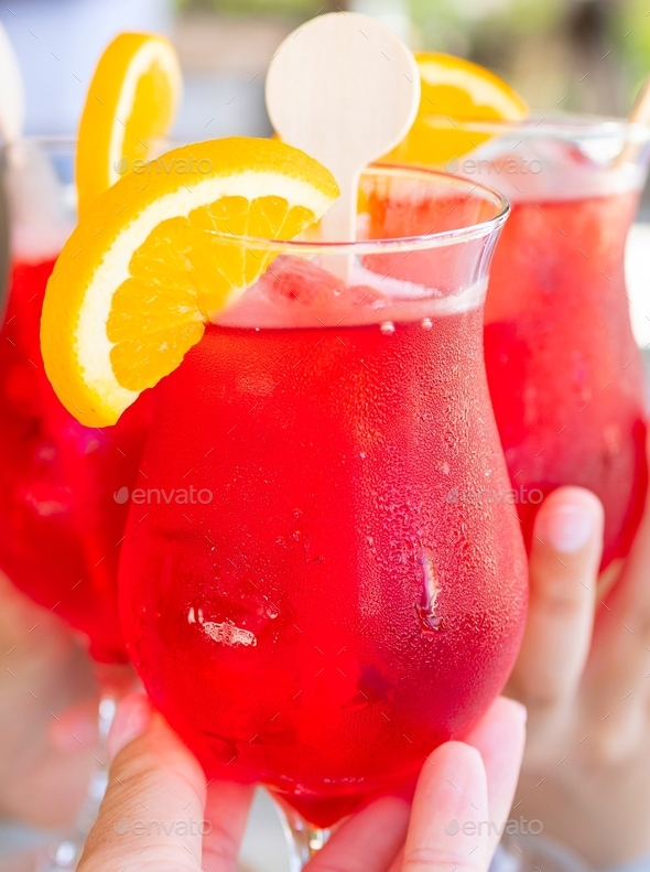 Three Glasses With Bright Red Cocktail Close Up In Hands Of Tourists In Maldives Island Concept 3889