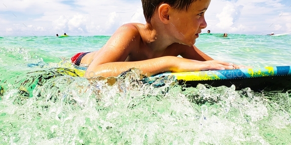 Little boy at sea thinking about the psychological aspect of a shark attack from down under....