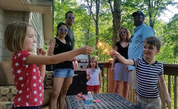Dueling sparklers with parents looking on for damage control...