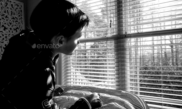 Gen z looking through a window in black and white.