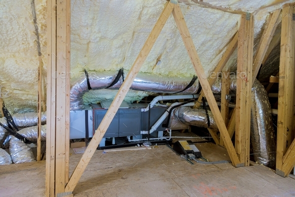 Air conditioning system attached to attic thermal foam plastic insulation new home installation of