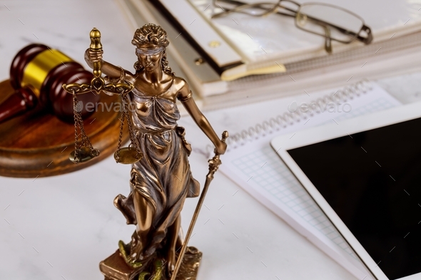 The Statue of Justice symbol, legal law office on a digital tablet of lawyers professional of Judge