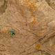 Man Climber Rock Climbing. Cliffs in Tamgaly Tas, Kazakhstan. Aerial View - PhotoDune Item for Sale