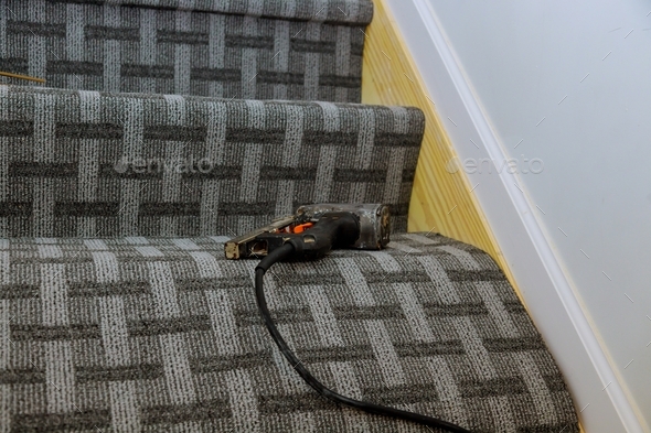 Installation out new carpet laying flooring in stairs