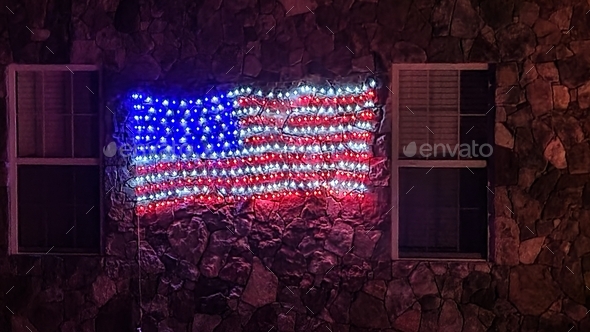 American flag lights up the night in neon colors of patriotism on home
