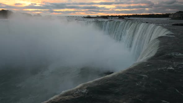 Dark View of Niagara Falls Water in Opposite To Pink Clouds of Very Early Sunrise