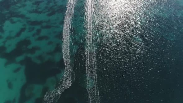 Aerial Drone Footage of Wavy Trace After Two Speedboats on Water of the Ocean