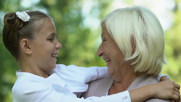 Grandmother and Granddaughter Hugging alt