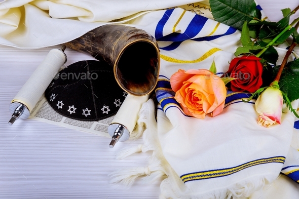 Judaism religious services in a synagogue. Torah scrolls and a shofar musical horn,