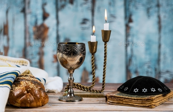 Homemade challah for Shabbat Shalom traditional Jewish ritual Prayer Shawl Tallit jewish religious