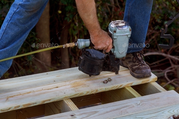 Close up of exterior timber decking building a backyard deck with composite deck boards