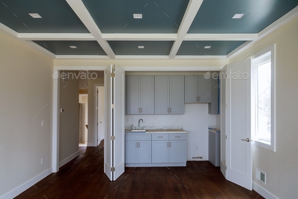 Interior design construction of passover kitchen with cabinet maker installing custom