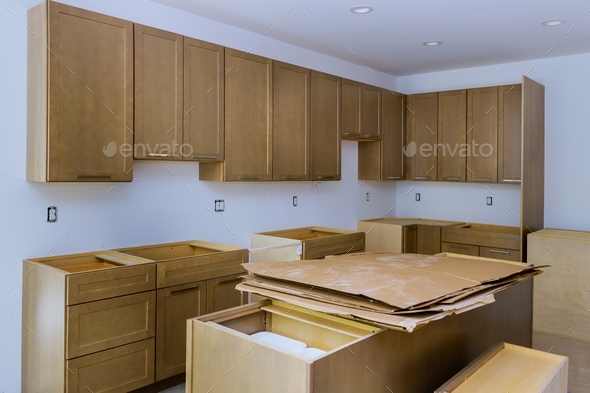 Interior design construction of kitchen remodel with cabinet maker installing home improvement