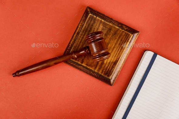 Table office lawyers Judge desk with wooden judges gavel a notebook