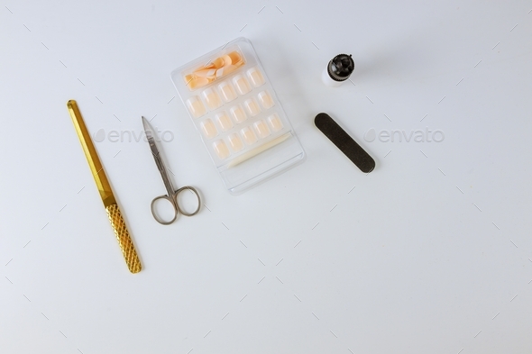 Manicure stage preparation for on gluing nail at beauty salon.