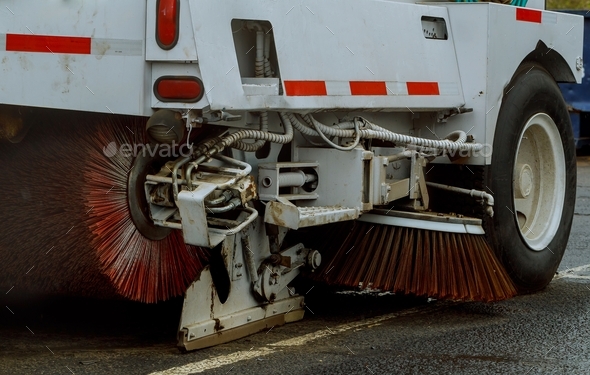 Cleaning streets of the city with the help of a harvesting machine