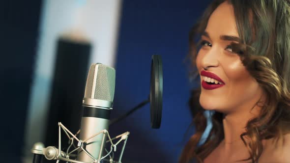 Female vocal. Woman singing in the recording studio. alt