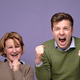 Happy overjoyed family mother and son clenching fists widely in excitement, - PhotoDune Item for Sale