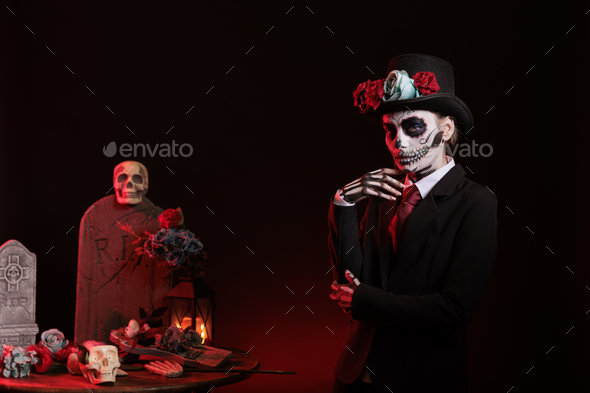 Santa muerte with suit and hat looking mysterious Stock Photo by DC_Studio