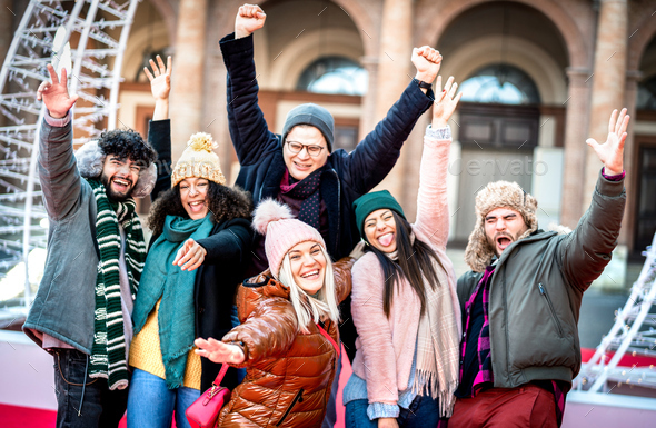 Multicultural guys and girls students on group photo wearing warm trendy clothes - Stock Photo - Images