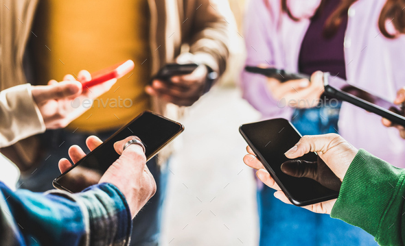 Closeup of people hands using data on mobile smart phones - Stock Photo - Images