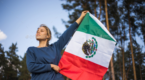 People holding flag of Mexico. \