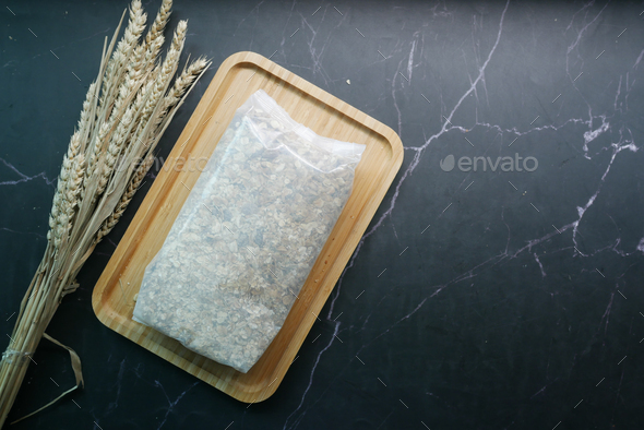 top view of oats flakes in a plastic packet on table