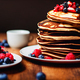 Stack of homemade pancakes with berries, trendy modern desserts, healthy food with cereals. - PhotoDune Item for Sale