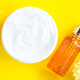 Generic white cream jar and glass serum on yellow background - PhotoDune Item for Sale