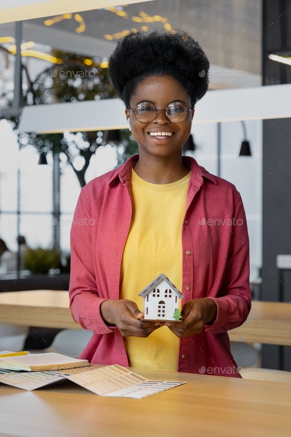 a millennial african american woman interior designer or architect designs a new home - Stock Photo - Images