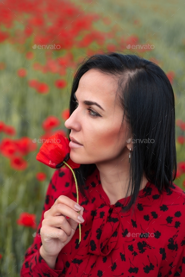 Woman in red dress in the poppiesfield Stock Photo by AlexanderLipko