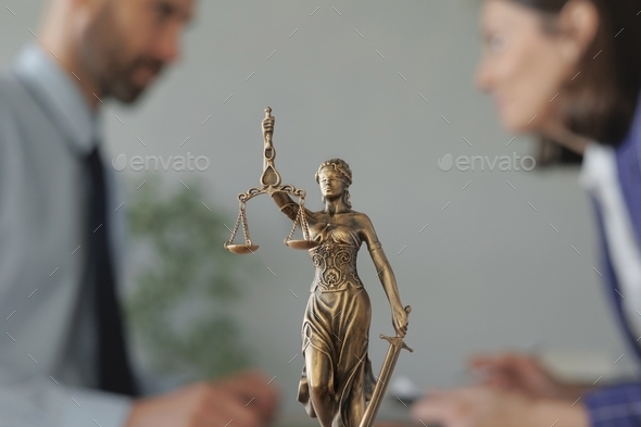 legal assistance during the period of self-isolation. a statuette of the goddess of justice
