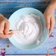 a-little-girl-hands-making-slime-herself-on-blue-wooden-background-slime- making-hand-children-toy_t20_rRaG0g - The Breakie Bunch Learning Center