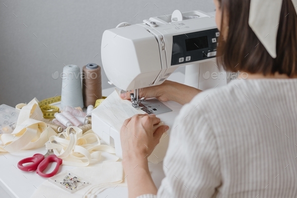 professional seamstress-a woman does what she loves and sews. small business and self-employment