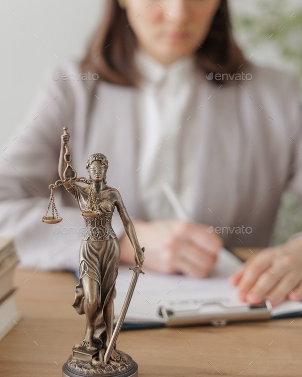 statuette of the goddess of justice. a symbol of honesty and decency