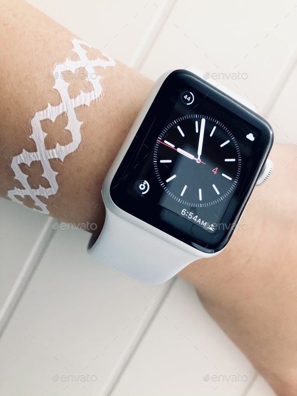 Apple watch on arm on white background - Stock Photo - Images