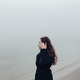 Woman on a foggy beach  - PhotoDune Item for Sale
