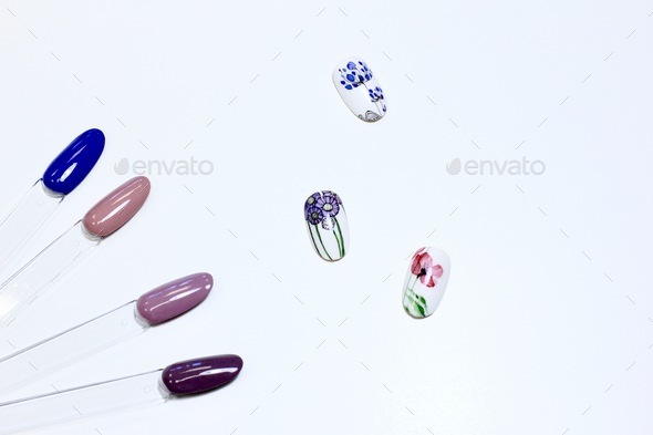 Background of multicolored nail polish samples. Fashion manicure. Nail design.