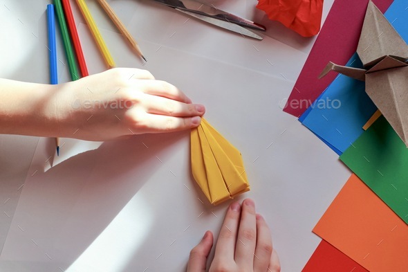 Concept of children's creativity, origami, back to school.