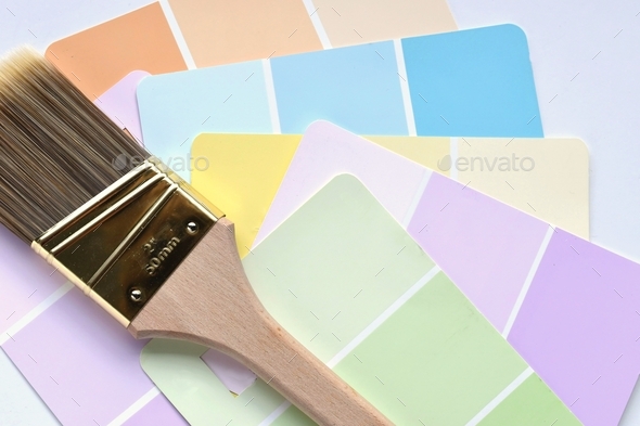 Vibrant pastel paint color samples with a paintbrush. Paint swatches for choosing a new color.
