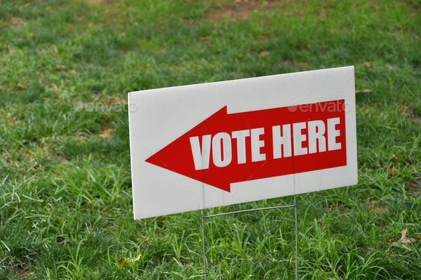 Sign showing where to vote on election day at the polling place. Vote Here