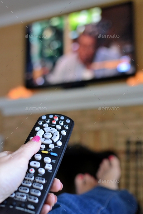 A woman relaxing and binge watching her favorite movies and TV shows. Movie Night - Stock Photo - Images