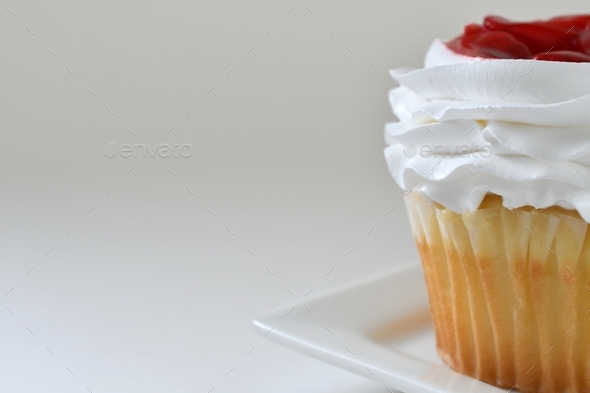 Strawberry shortcake cupcake dessert on a simple white background. minimal, minimalism