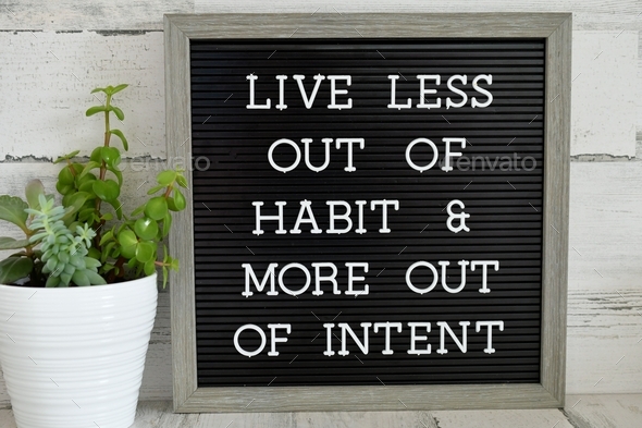 Message letter board with the saying or quote - Live less out of habit & more out of intent