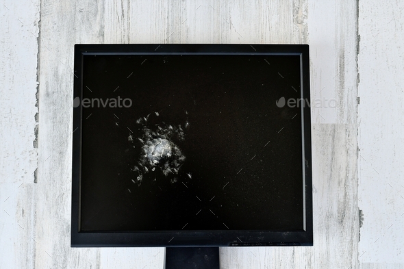 Concept - broken smashed computer monitor to represent internet or network being down & unavailable.