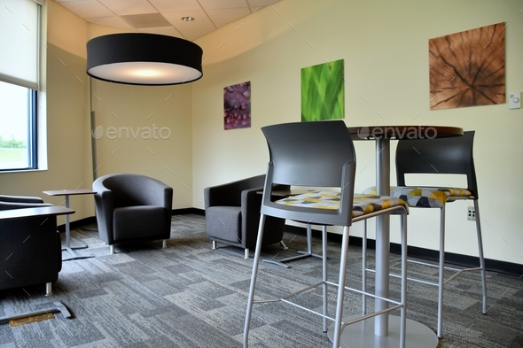 Clean, modern break room, recreation area in an office building environment.