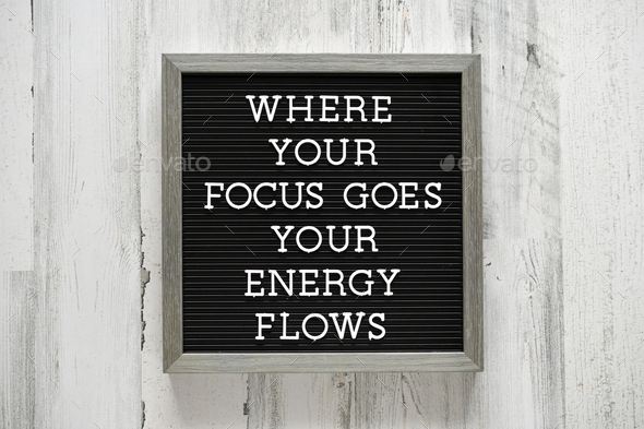 Message letter board with the saying or quote - Where your focus goes, your energy flows