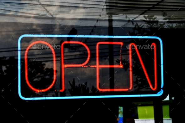 Neon OPEN sign in teal and orange - Yes, we\'re open for business