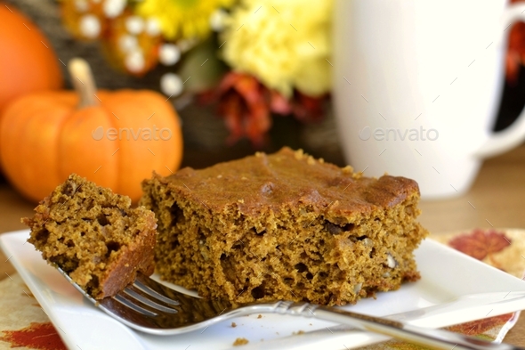 Pumpkin spiced brownies cake with coffee and autumn decor